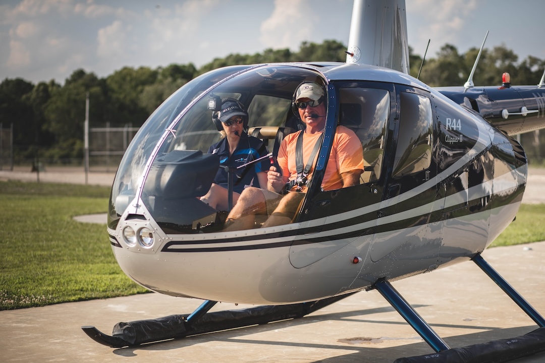 Certified helicopter pilot preparing for takeoff